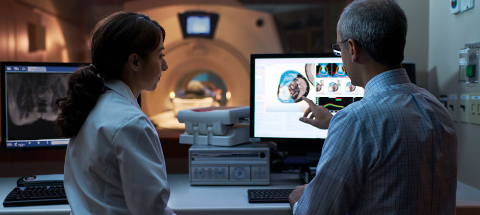 Female and male doctor looking at scan