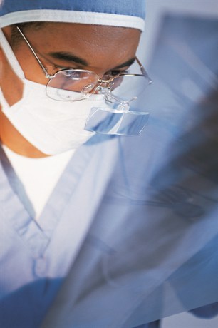 Surgeon looking at an x-ray