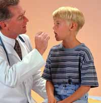 Picture of a doctor examining a young boy