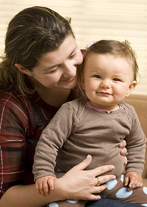 Woman holding baby on her lap.