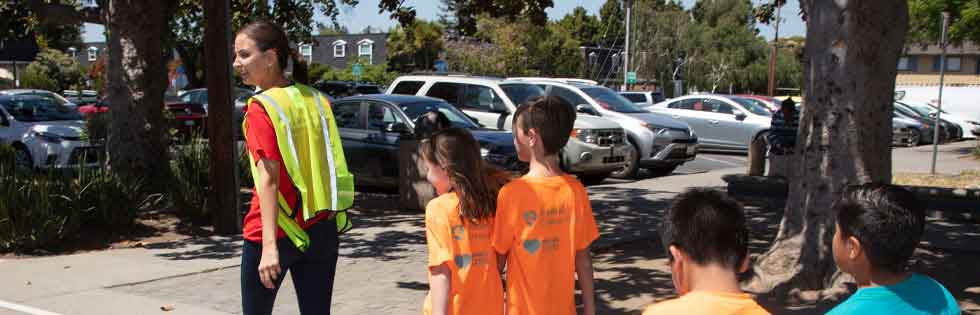 Stanford Medicine Children's Health employee walking with class
