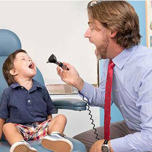 doctor examining child patient